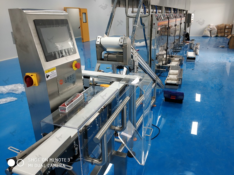 in-line checkweigher for functional drink powder production